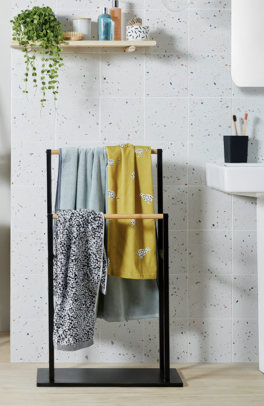 A free-standing towel rail is a nice towel storage solution for a bathroom that isn't tight on space.